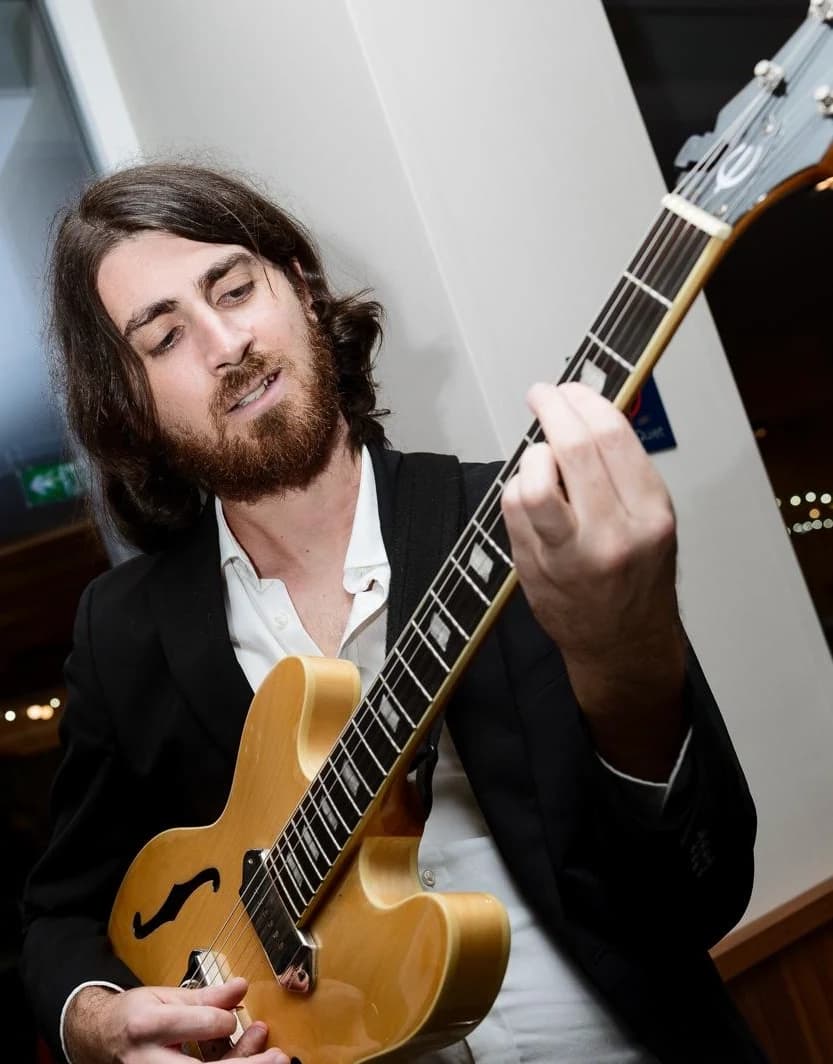 Warren Galea playing guitar